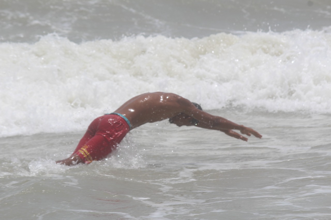 Safe swimming zones marked with flags.